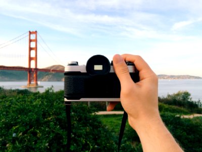 person holding black and gray camera photo