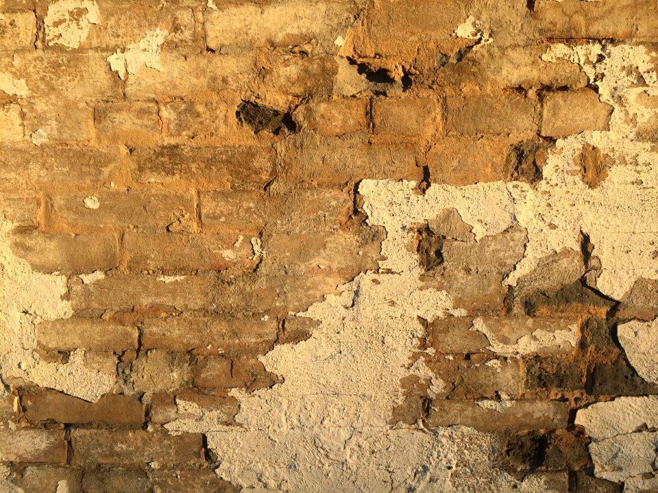 An aged brick wall.