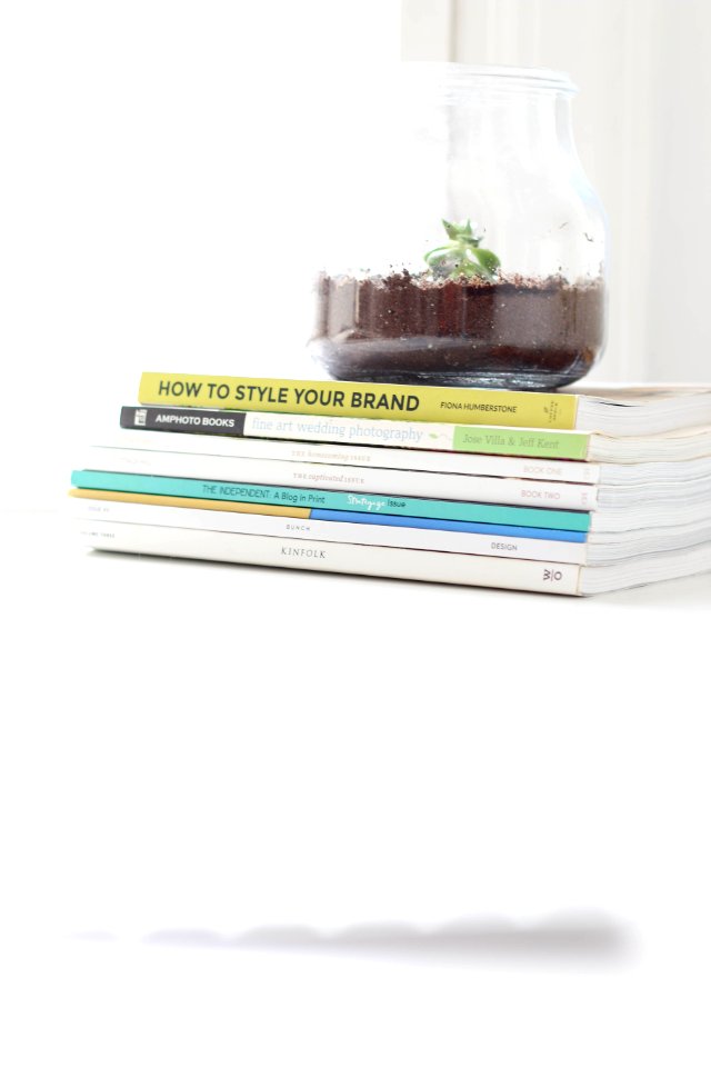 stack of books on white table