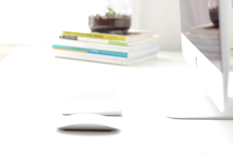 white notebook on white table
