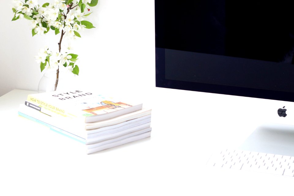 assorted book near iMac
