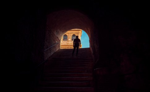 man standing on stairs photo