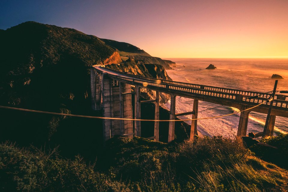 landscape photography of bridge near mountain