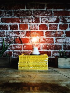 light bulb on pile of books photo