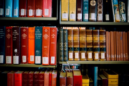 assorted-title books on shelf photo