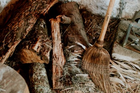 brown broom on brown fire logs photo