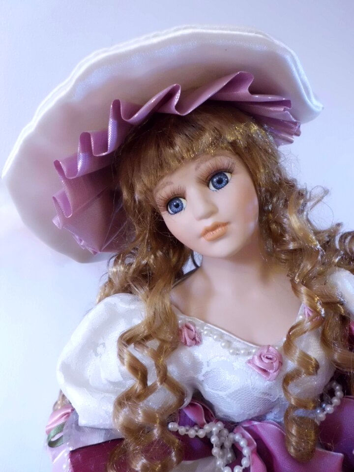 Girl faces dolls head