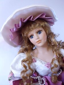 Girl faces dolls head