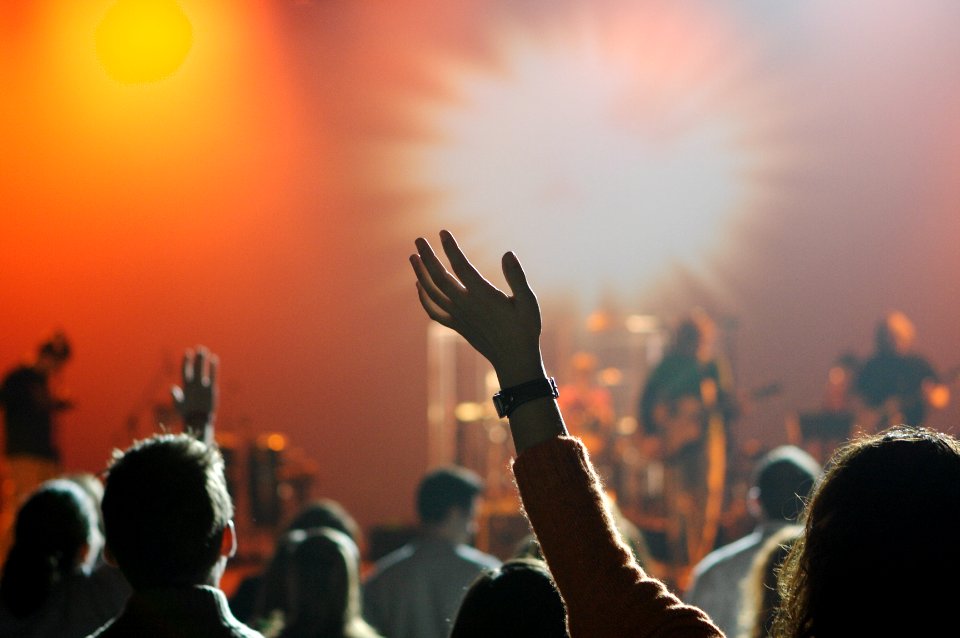 shallow focus photography of hand and people photo