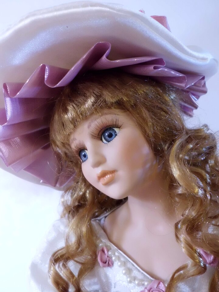 Girl faces dolls head