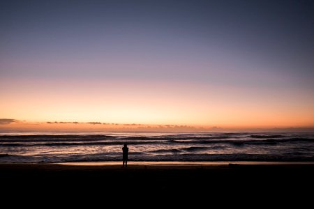 person in the beach during sunset