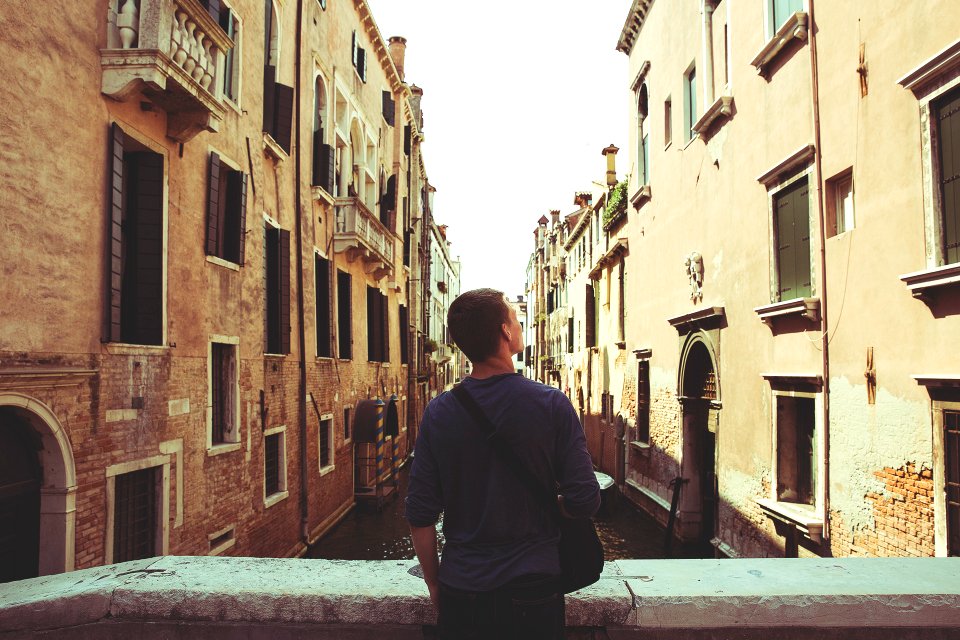 man standing in bridge