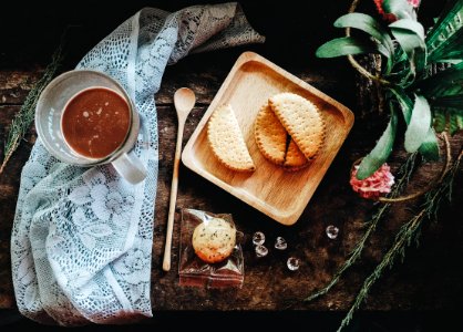 flat-lay photography of pastry on tray beside glass mug photo