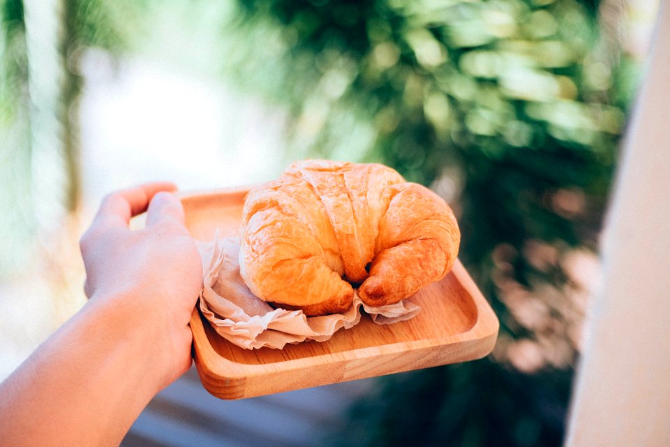 croissant on wooden plate