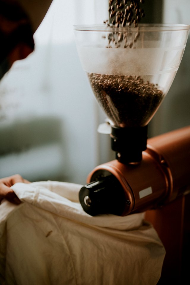 person milling coffee photo