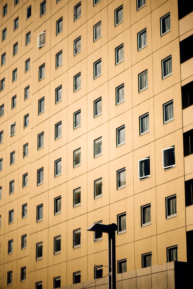 beige concrete high rise building facade photo