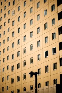 beige concrete high rise building facade photo