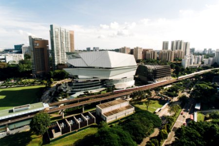 bird's-eye view of white high-rise building beside train track photo