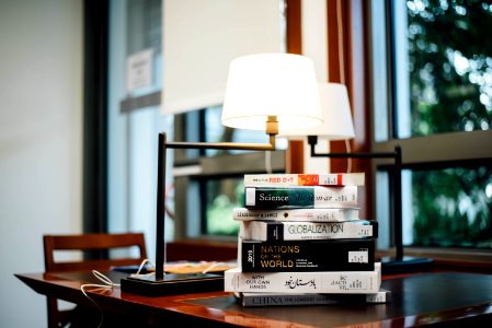 book stack beside table lamp
