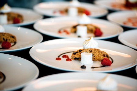 desserts served on white ceramic plates photo