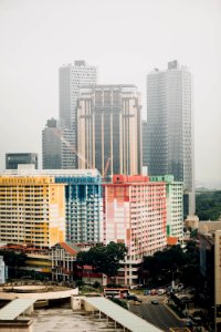 multicolored concrete high rise building near water photo