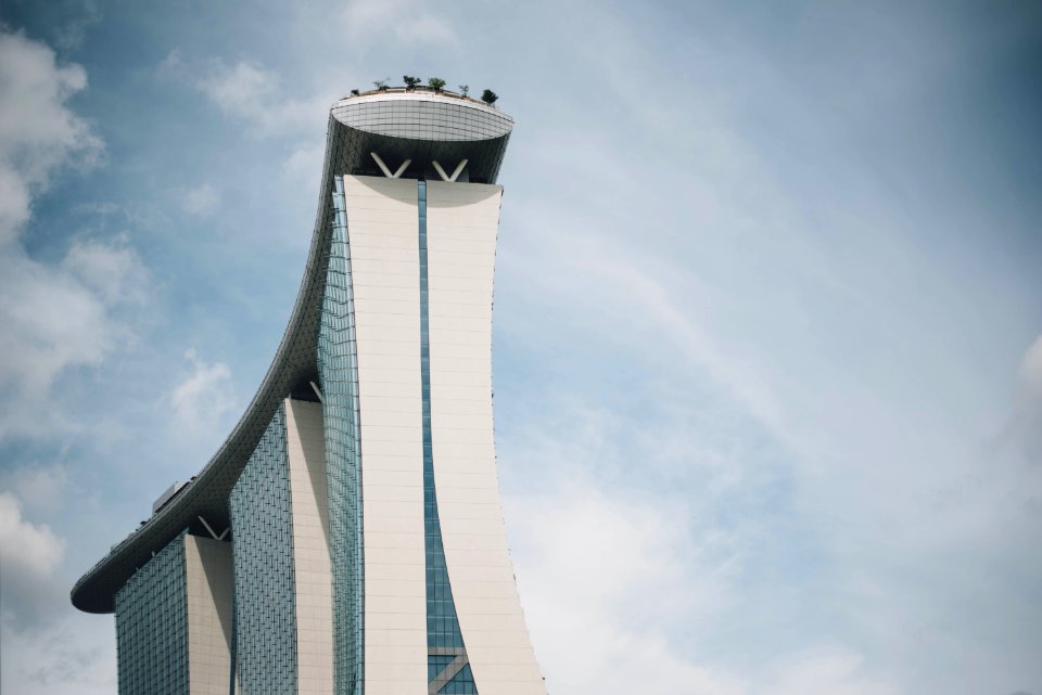 high rise building on Singapore under cloudy sky