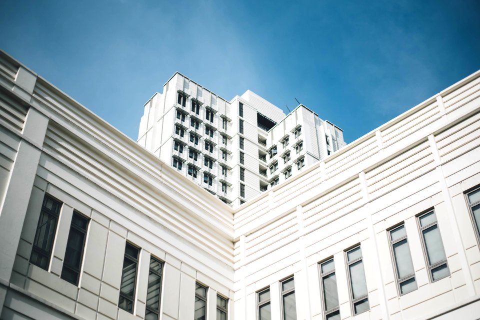 white concrete building under clear blue sky photo