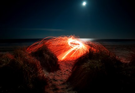 orange steelwool during night photo