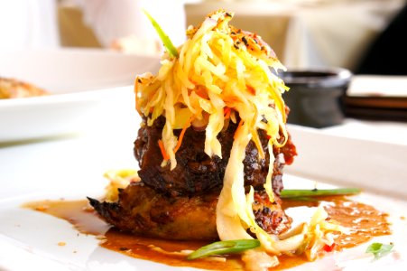 grilled meat with vegetable toppings