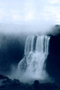 waterfalls in foggy weather during daytime photo