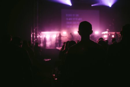 photo of man facing on stage photo
