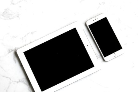 white iPad and silver iPhone 6