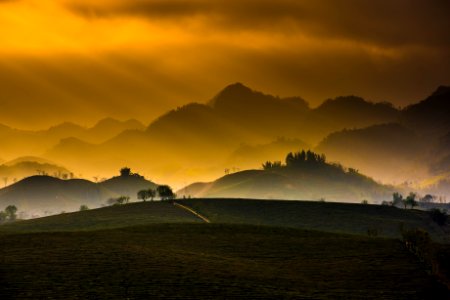 aerial photography of mountain and grass field photo