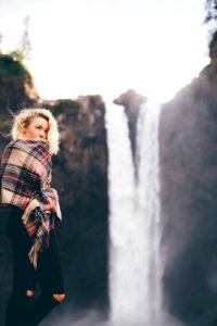shallow focus photography of woman covered with shawl photo