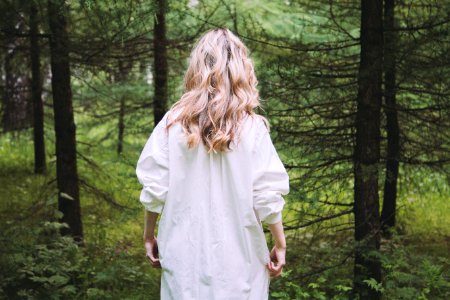 woman on white top in forest photo
