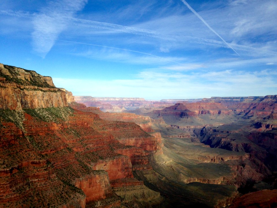 mountains under blue cloudy skies