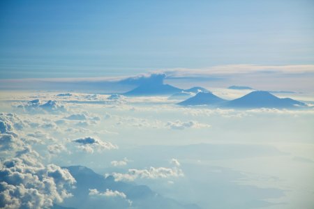 aerial photograph of clouds and mountain