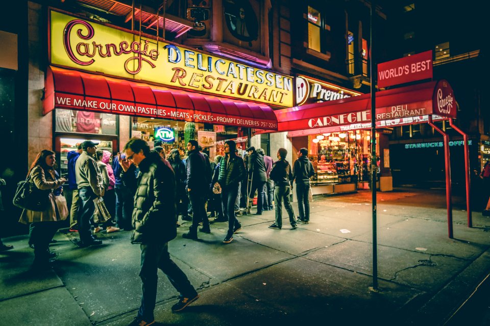 people in front of Carnegic Delicatessen Restaurant