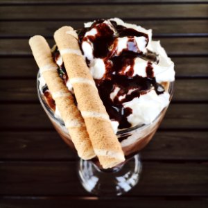 frappe with chocolate crunch sticks on footed glass photo