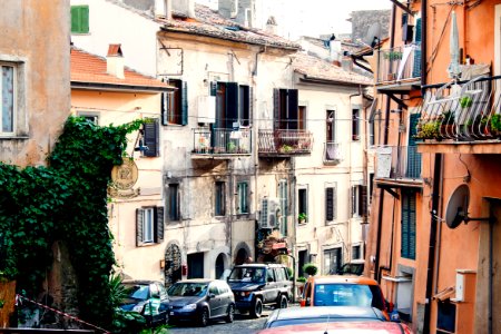 parked cars beside houses photo