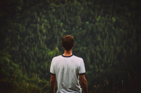 man wearing white ringer tee photo