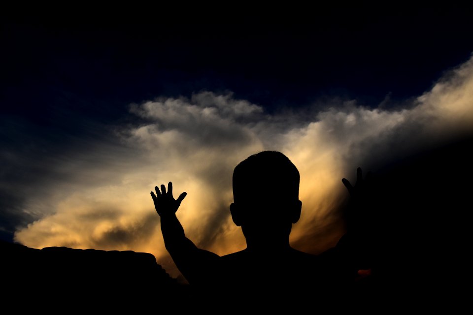 silhouette man looking at the sky