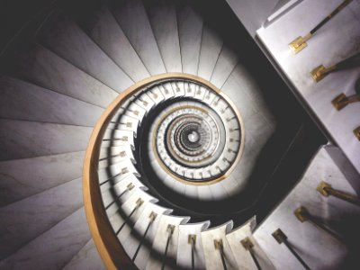 photo of spiral white stairs photo