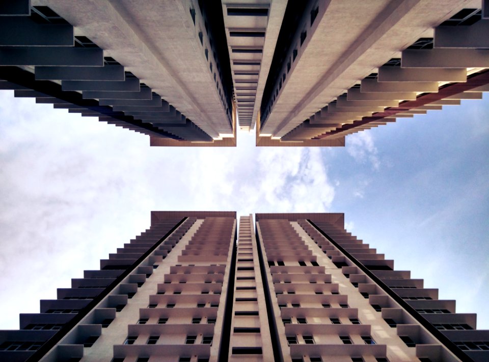 low-angle photography of two buildings