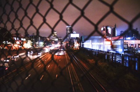 time lapse photography of vehicles on roadway at night time photo