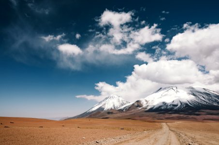 valley near snowy mountain photo