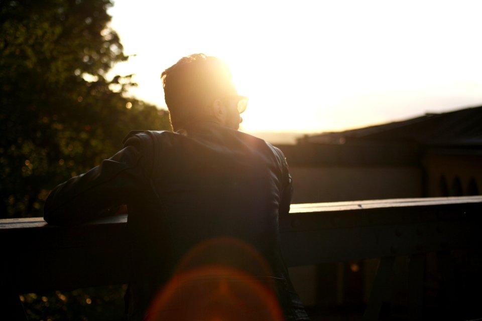 silhouette photography of person at ledge