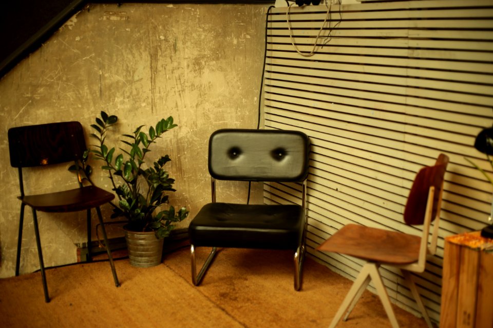 two brown and black chairs on brown wood flooring photo