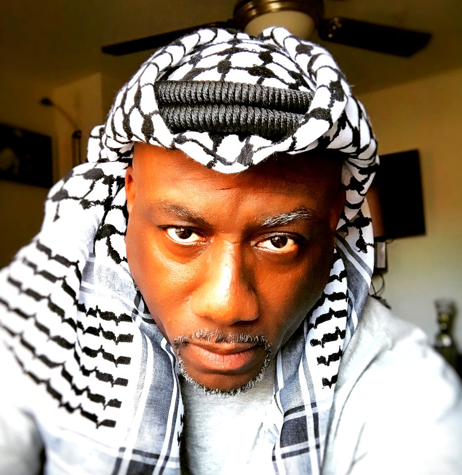 Black man wearing a keffiyeh