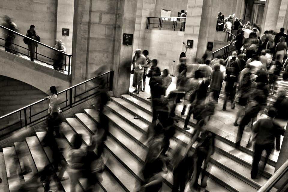 group of people walking on the stairs